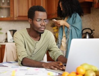 An African married man working remotely with this laptop.