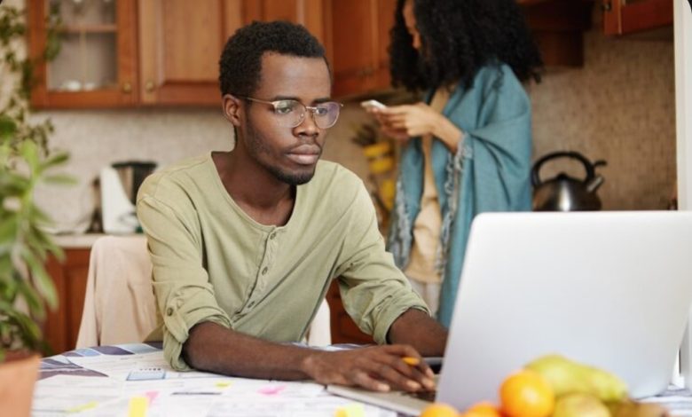 An African married man working remotely with this laptop.